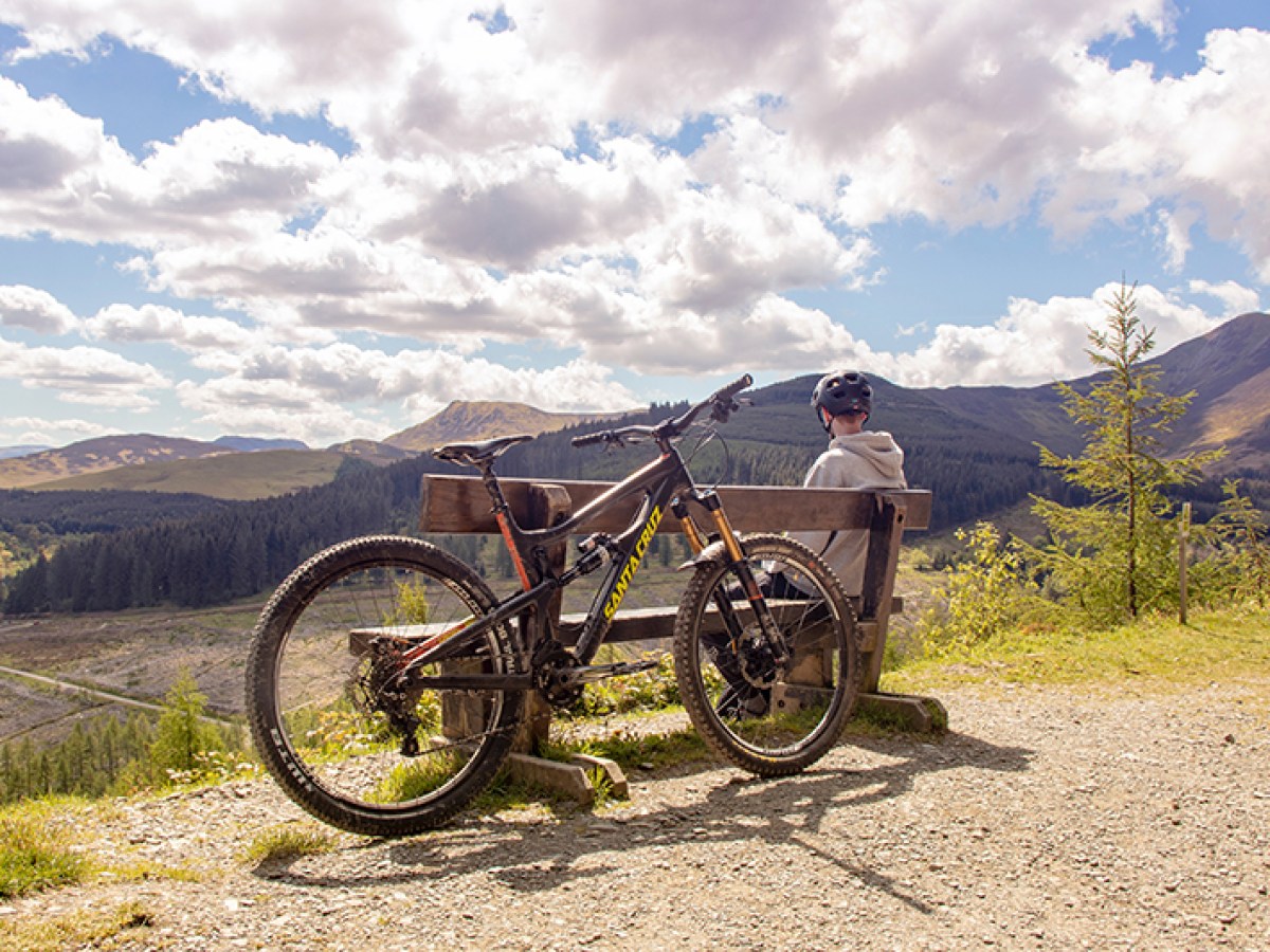 a bicycle parked on the side of a mountain