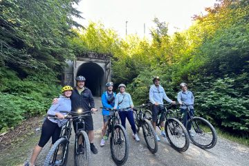 a group of people getting ready to ride through the Snoqualmie Tunnel