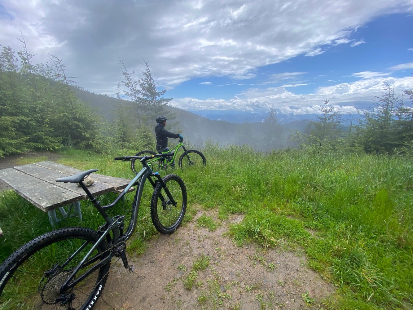 a bicycle parked on the side of a hill